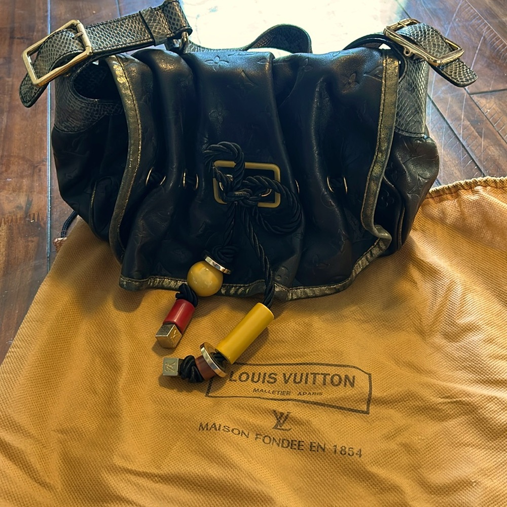 Louis Vuitton, used once, like new with protection bag. Comparison price $1750